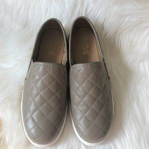 Brash tan slip on flat shoes